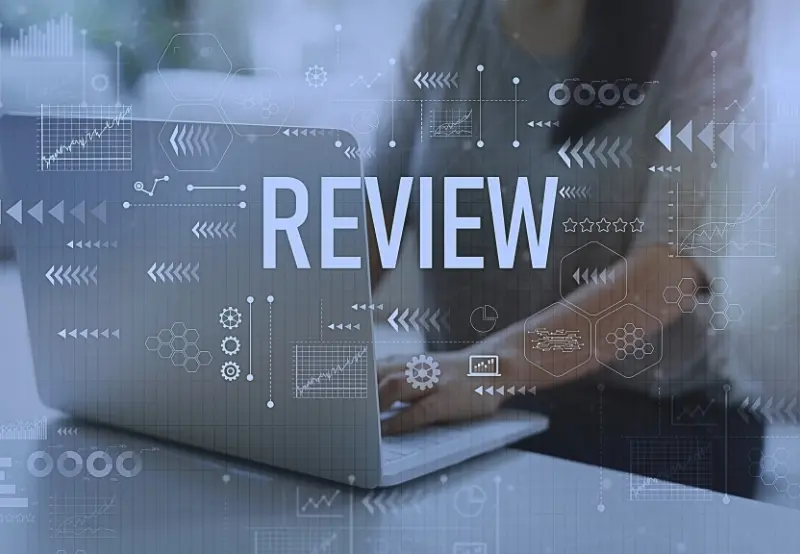 Laptop screen showing online review analytics and rating icons for dental practice reputation management