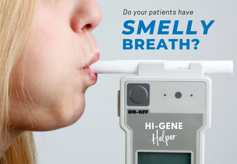 woman blowing into hi-gene helper breathalyzer