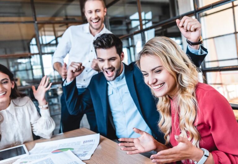 marketing team celebrating client success