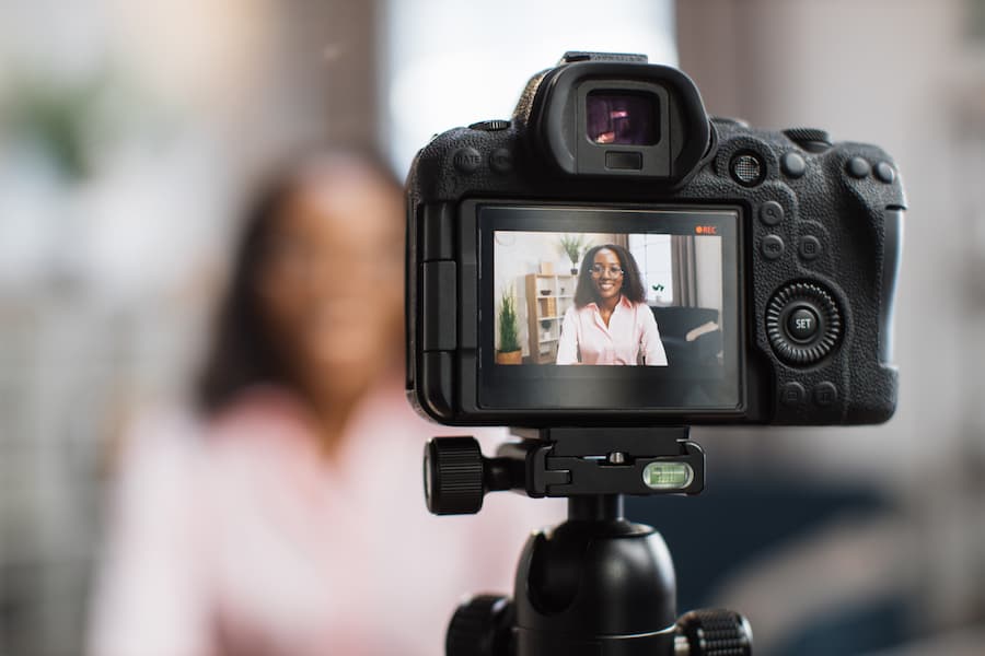 Woman being filmed on camera