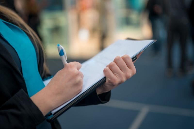 woman holding clipboard